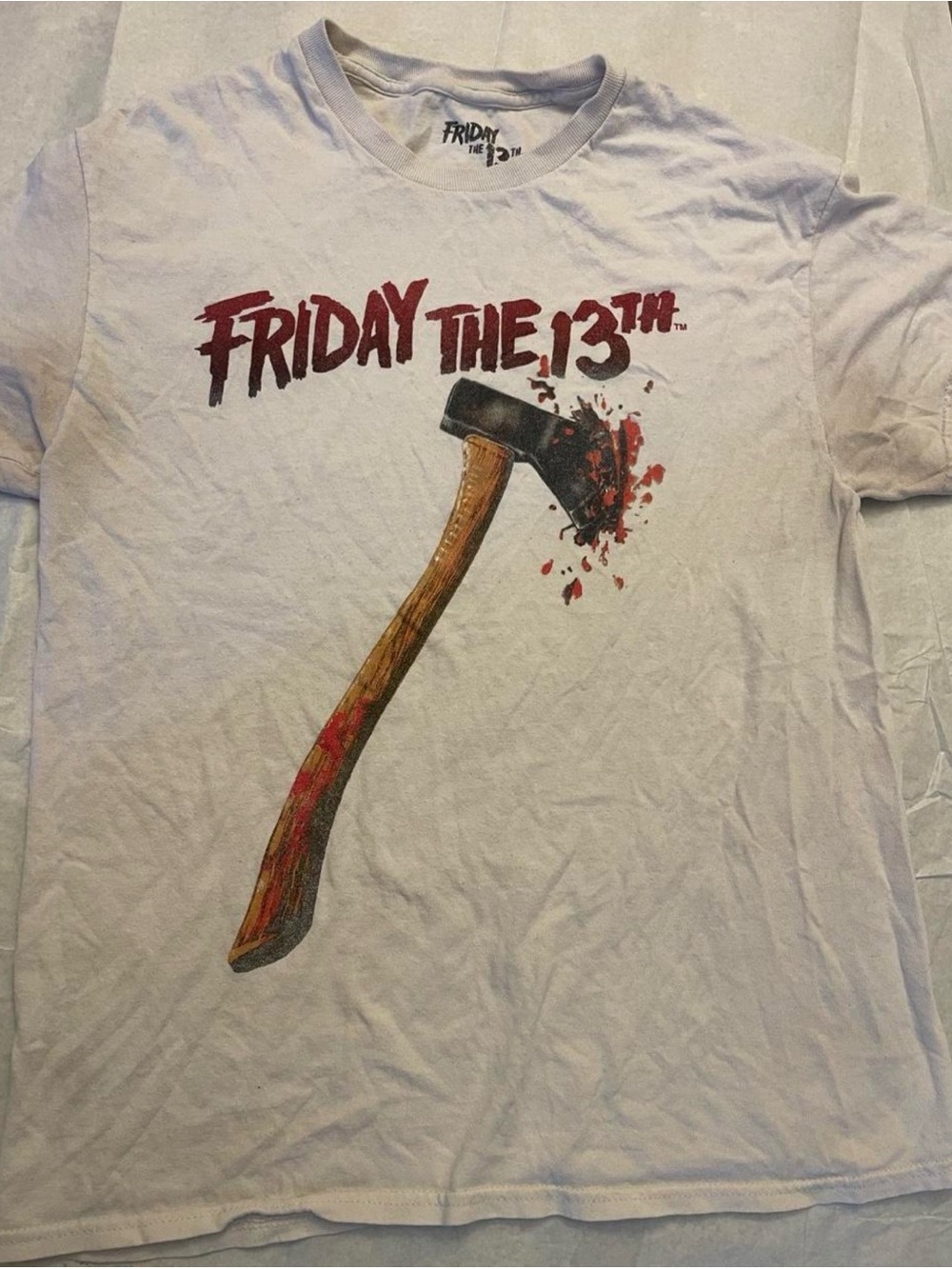 Friday the 13th Axe Cotton T-Shirt with graphic of an axe with blood splatter